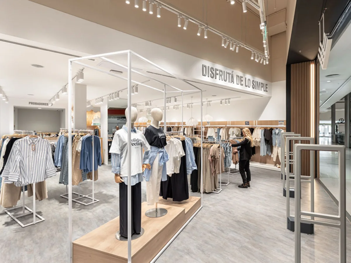 BAS Nuevo Centro - Store entrance display featuring mannequins and 'Enjoy the Simple' signage - Contract Workplaces.webp